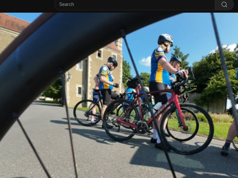 Image of Wheelers viewed through a bicycle wheel